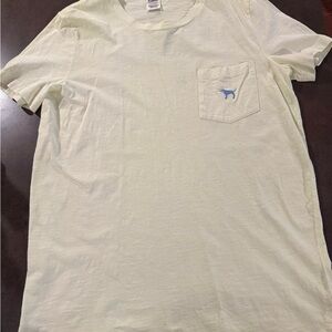 Pink T-Shirt with Blue Logo. Yellow color.